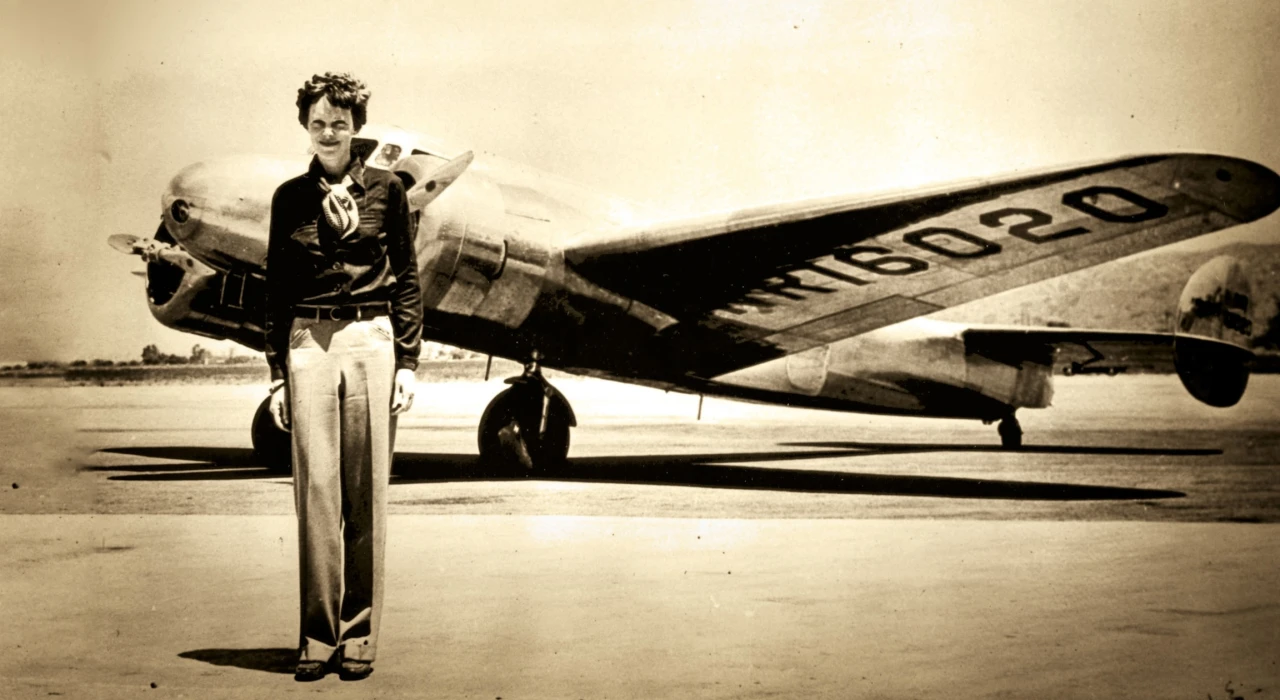 Amelia Earhart standing in front of airplane